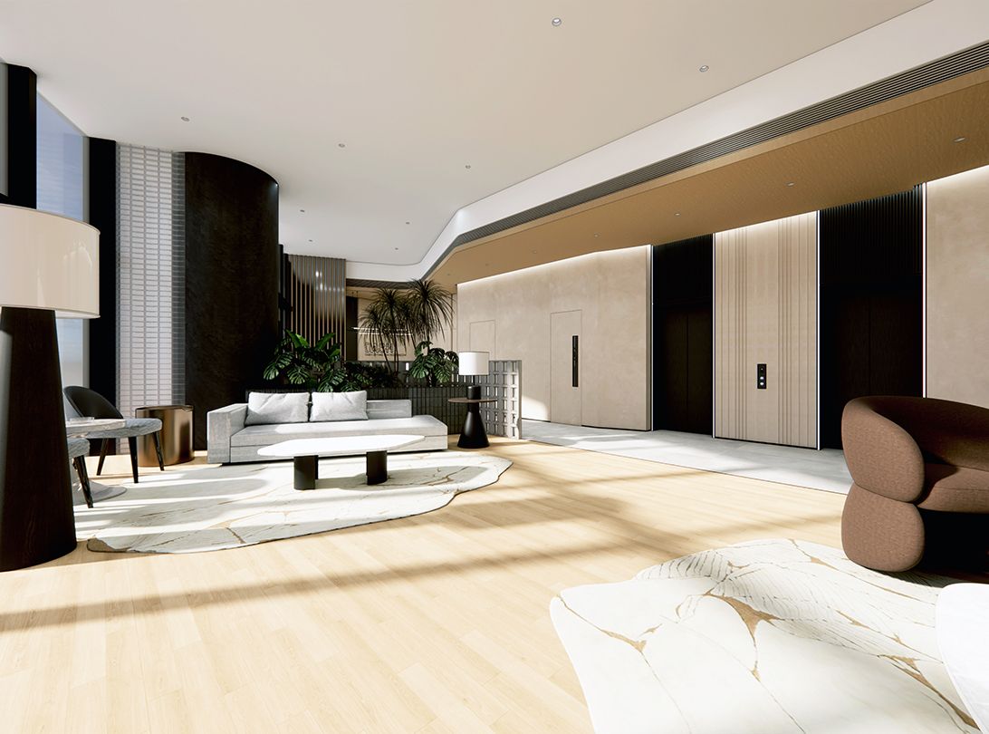 Bright, modern hotel lobby with white sofas, dark paneling, and light wooden floors.