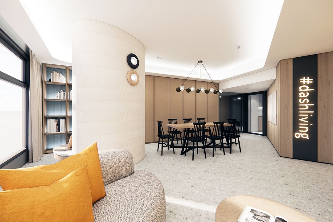 Modern common area featuring a curved sofa, dining table, bookshelf, and #dashliving branding.